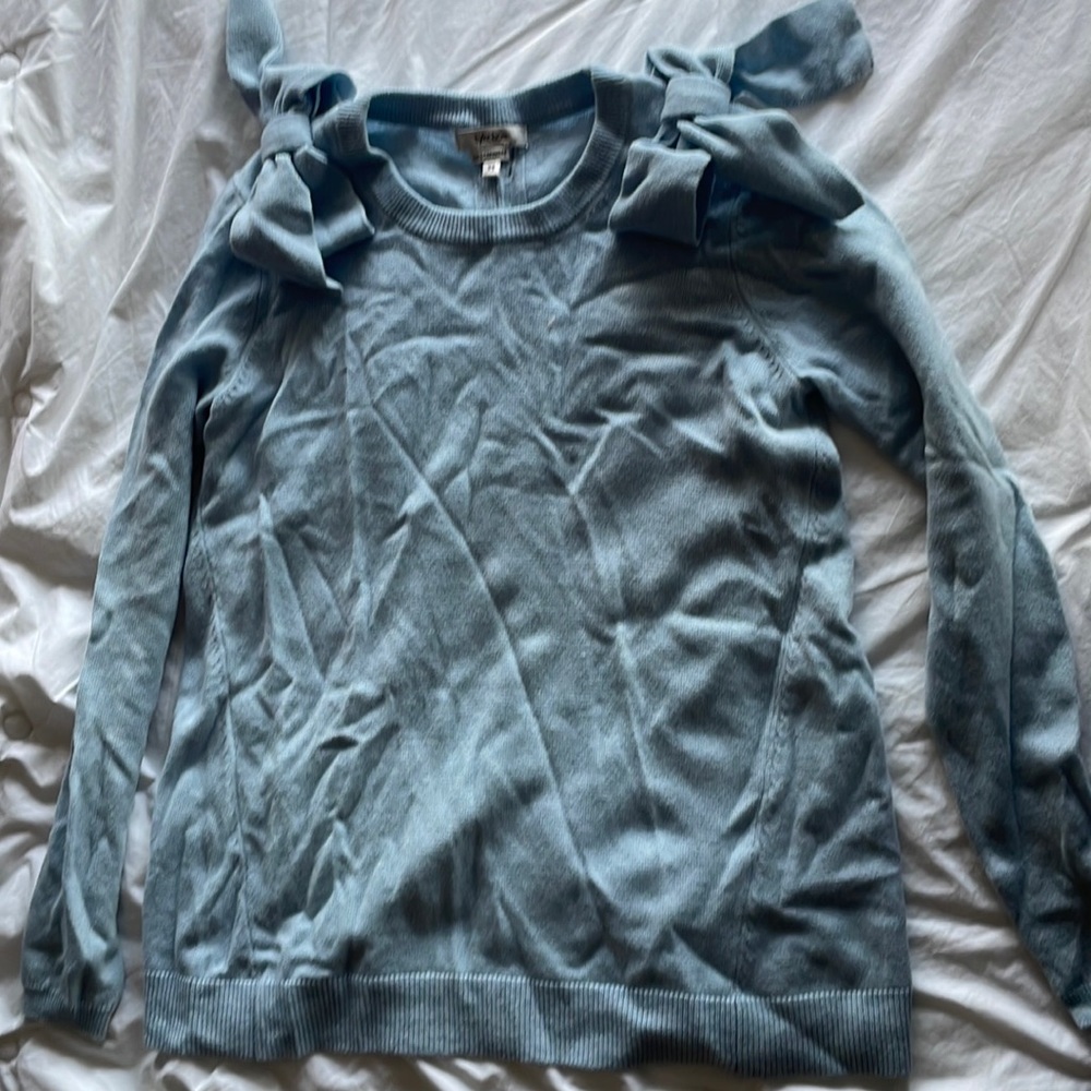 100% cashmere Tyler Boe light blue sweater with bows on the shoulders